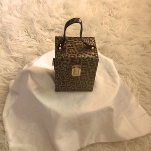 Novel animal print metallic finish handbag